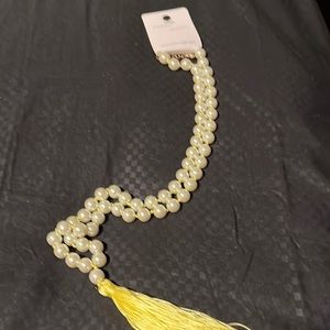 Pearl and yellow adjustable sweater necklace. Apx 18 inches long